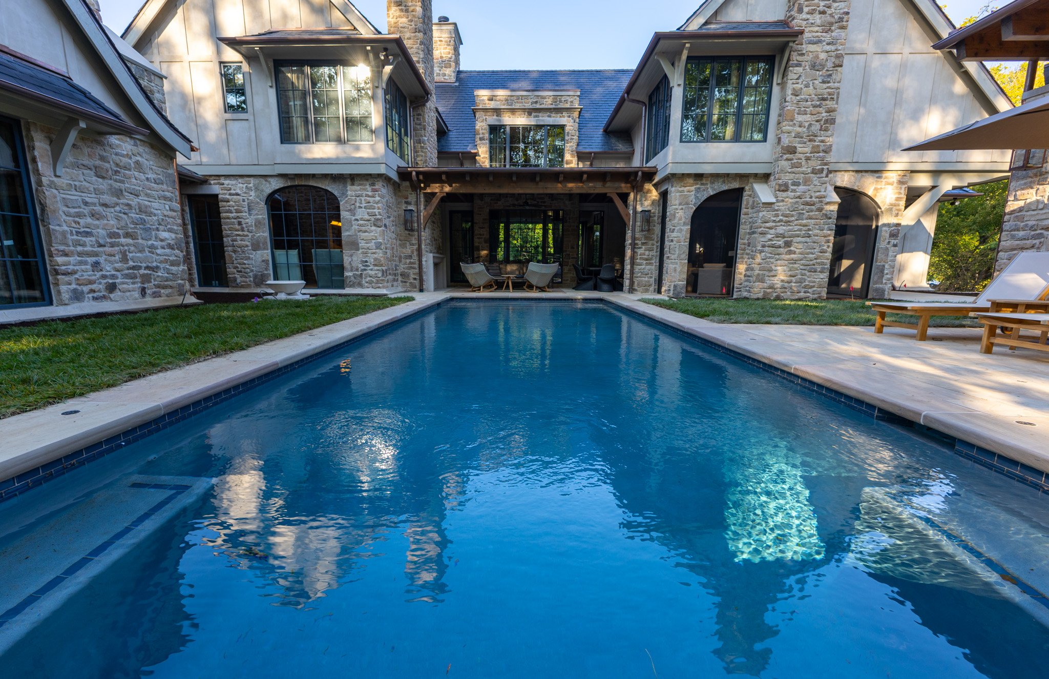 Pool area at Villa Di Roccia luxury home by Brentwood Builders