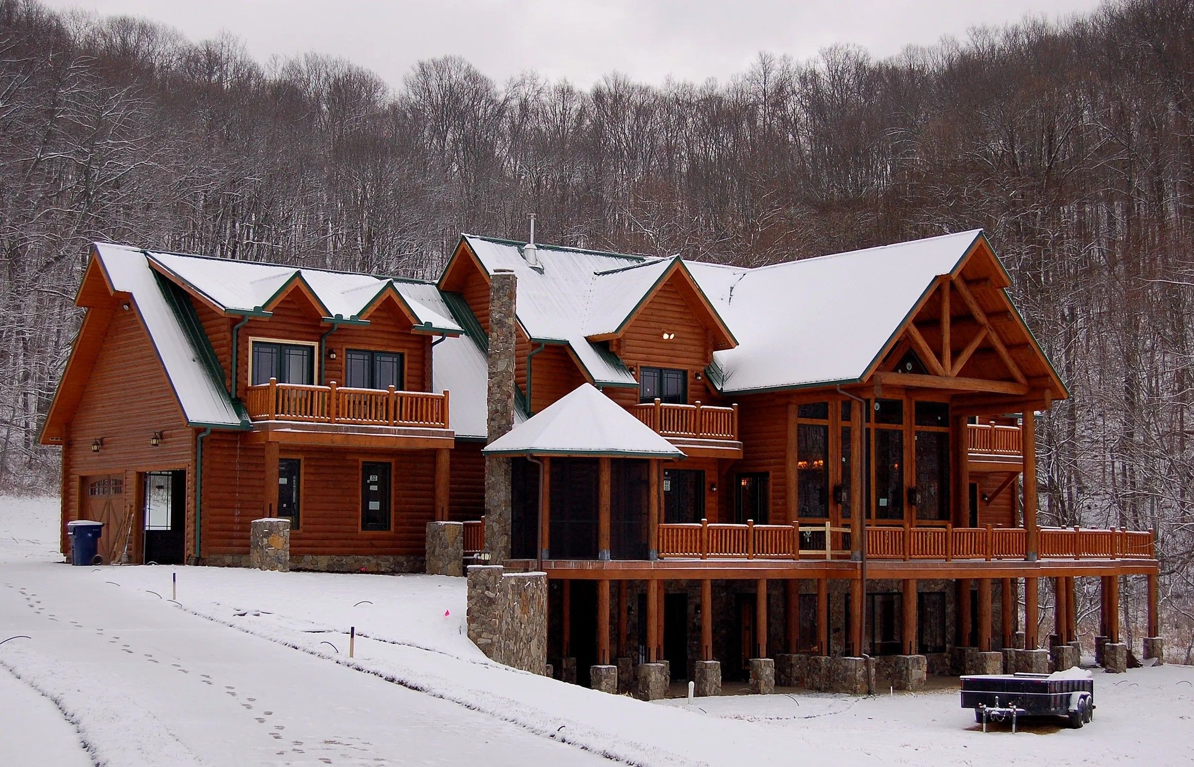 Snowy log cabin lodge built by a custom home builder in Leipers Fork, Tennessee