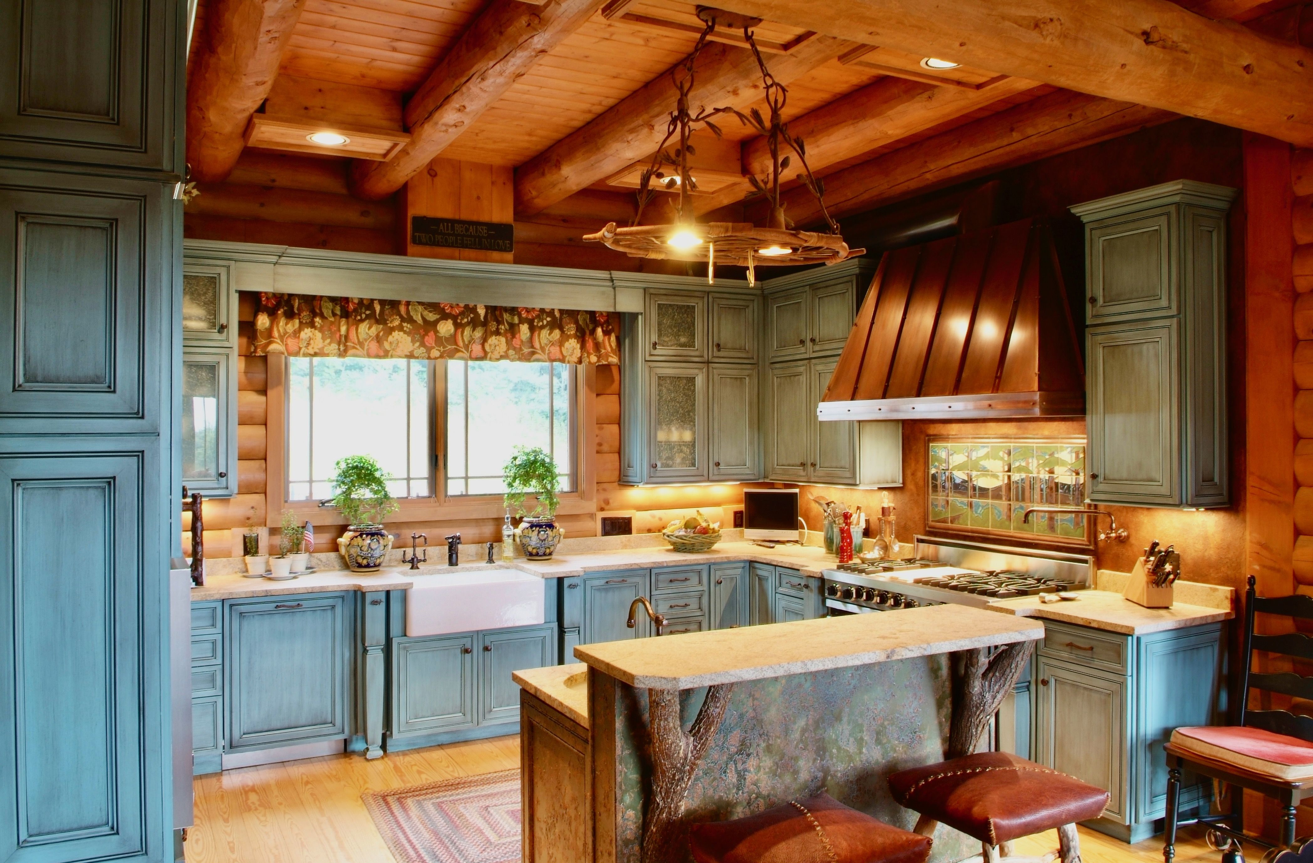 Kitchen view of a log cabin lodge built by a custom home builder in Leipers Fork, Tennessee