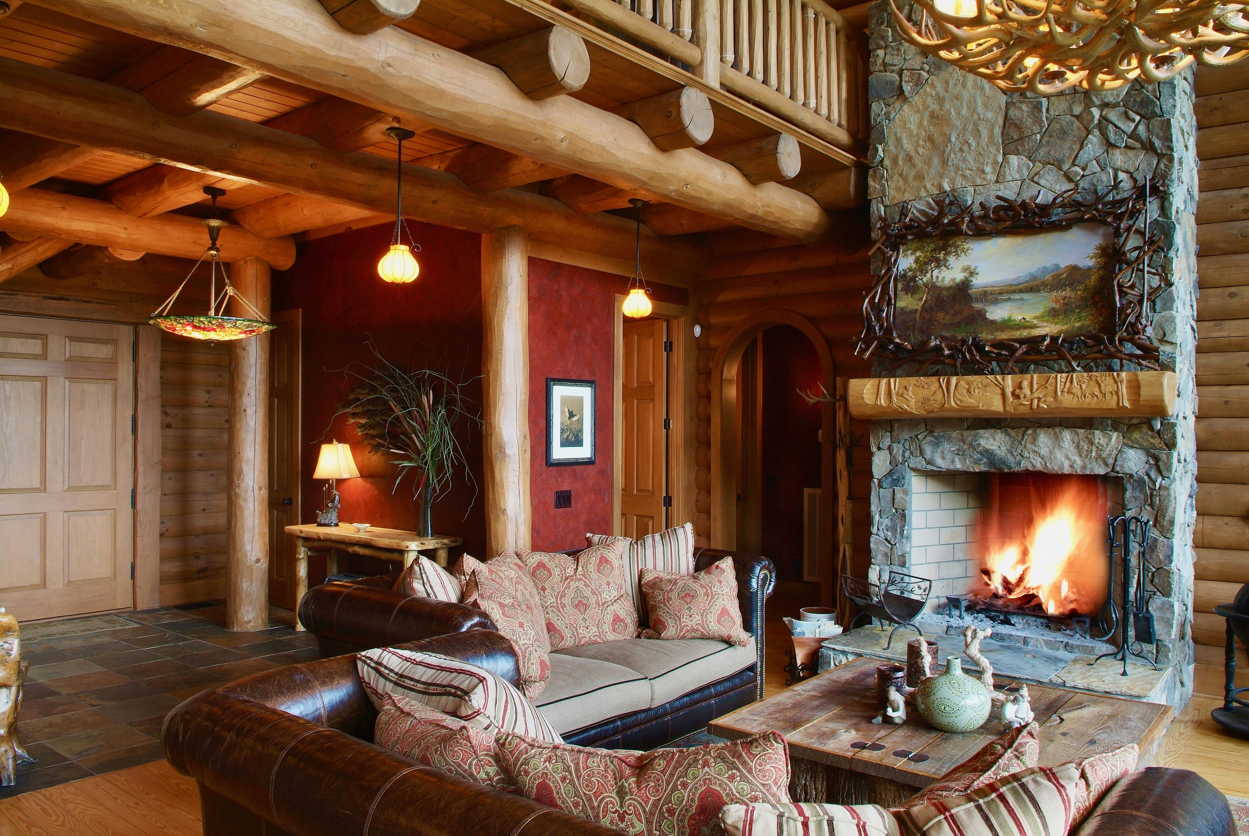 Living room of a log cabin lodge built by a custom home builder in Leipers Fork, Tennessee