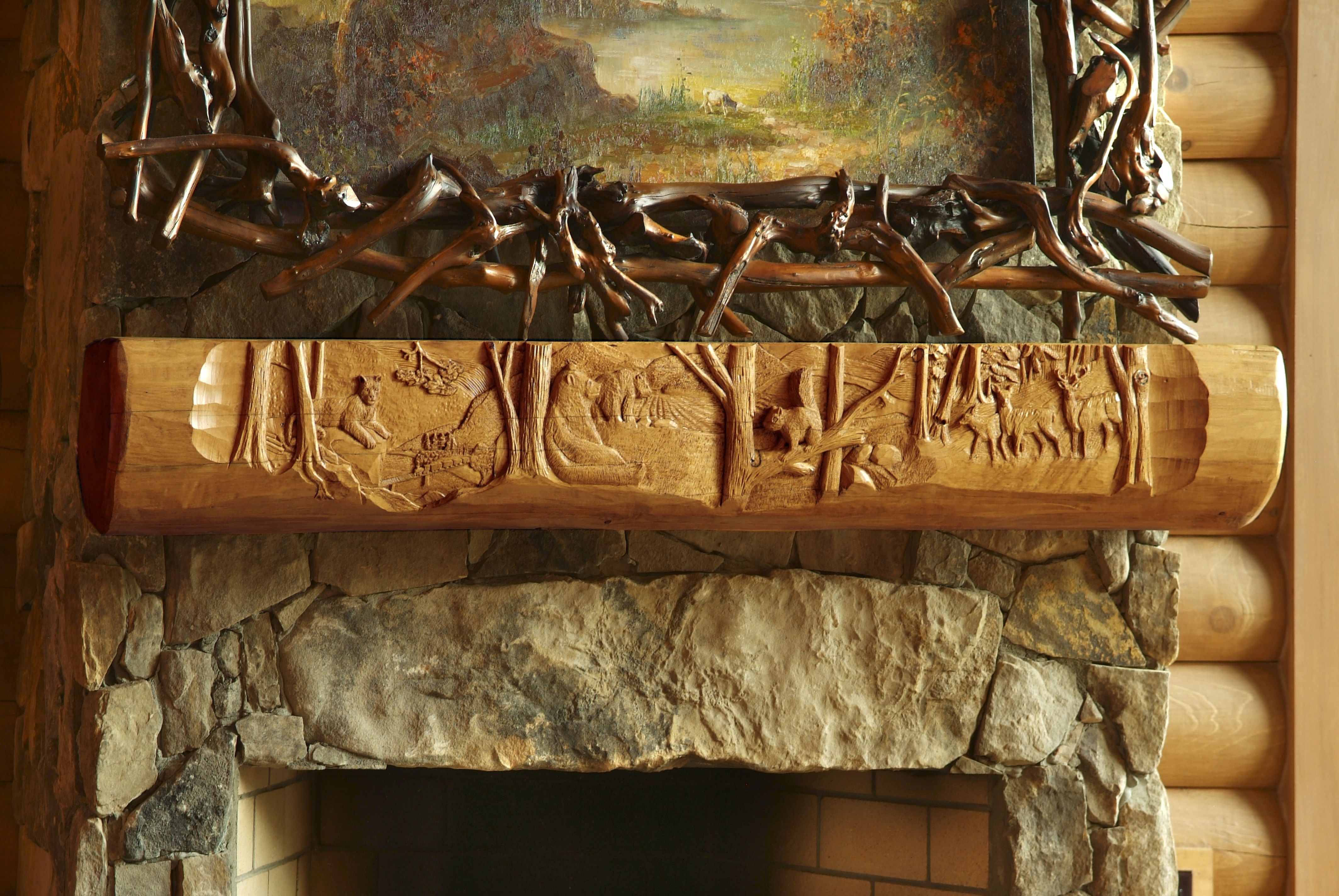 Mantel of a log cabin lodge built by a custom home builder in Leipers Fork, Tennessee