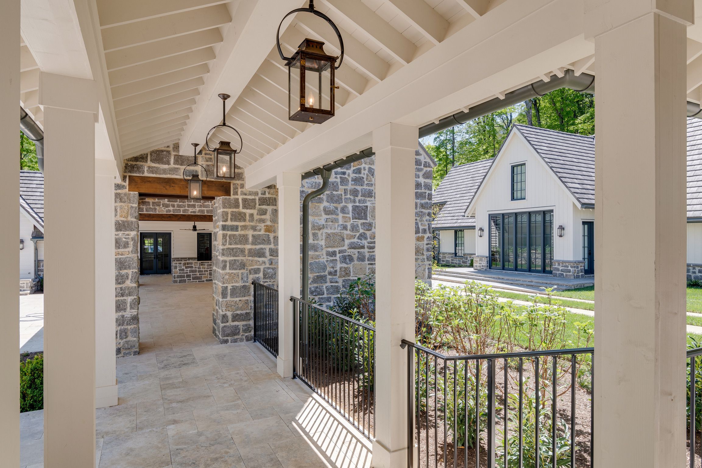 Exterior walkway of a modern farmhouse built by a custom home builder in Brentwood, Tennessee