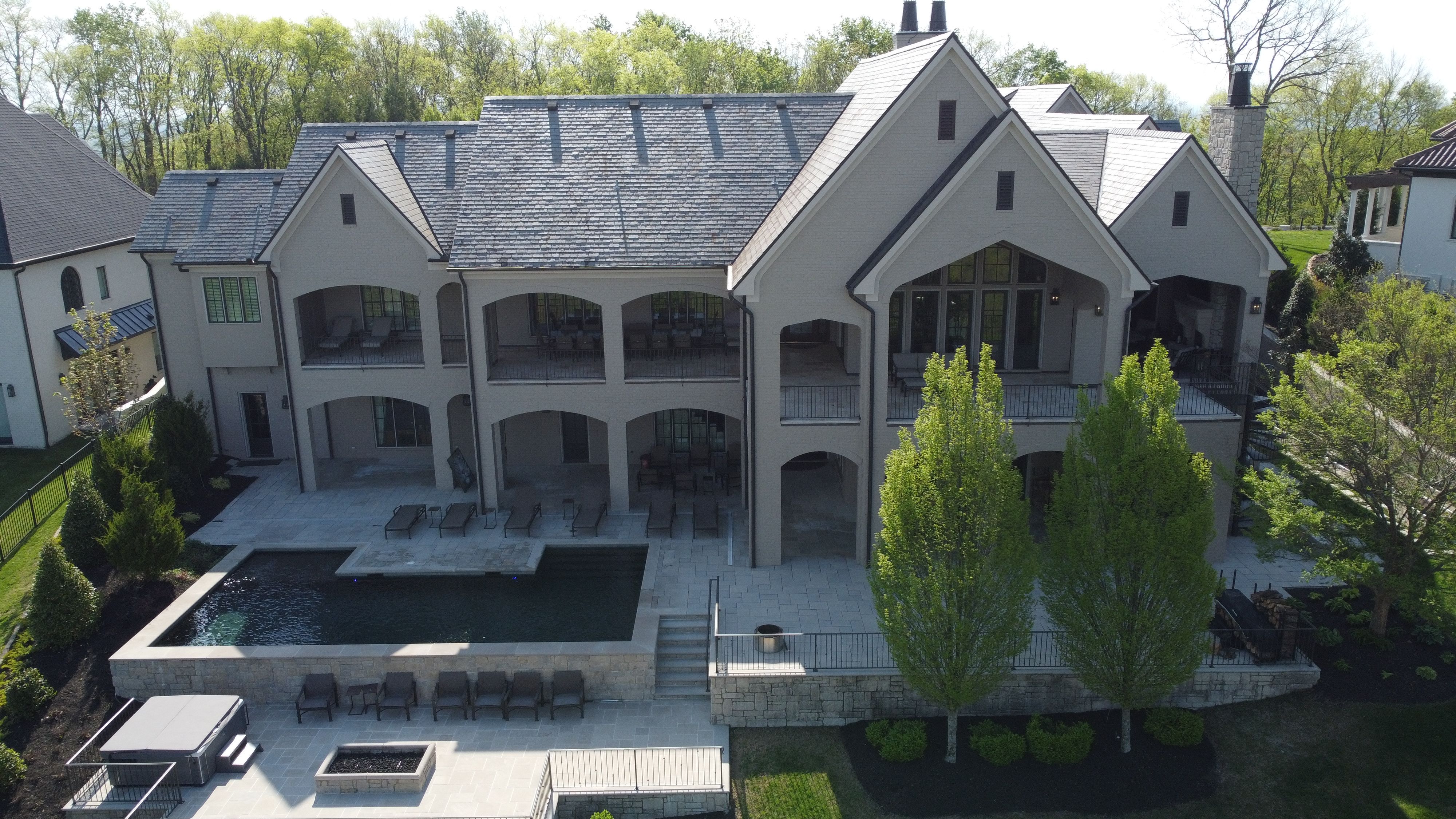 Back elevation of a luxury custom european style home built by a custom home builder in Franklin, Tennessee