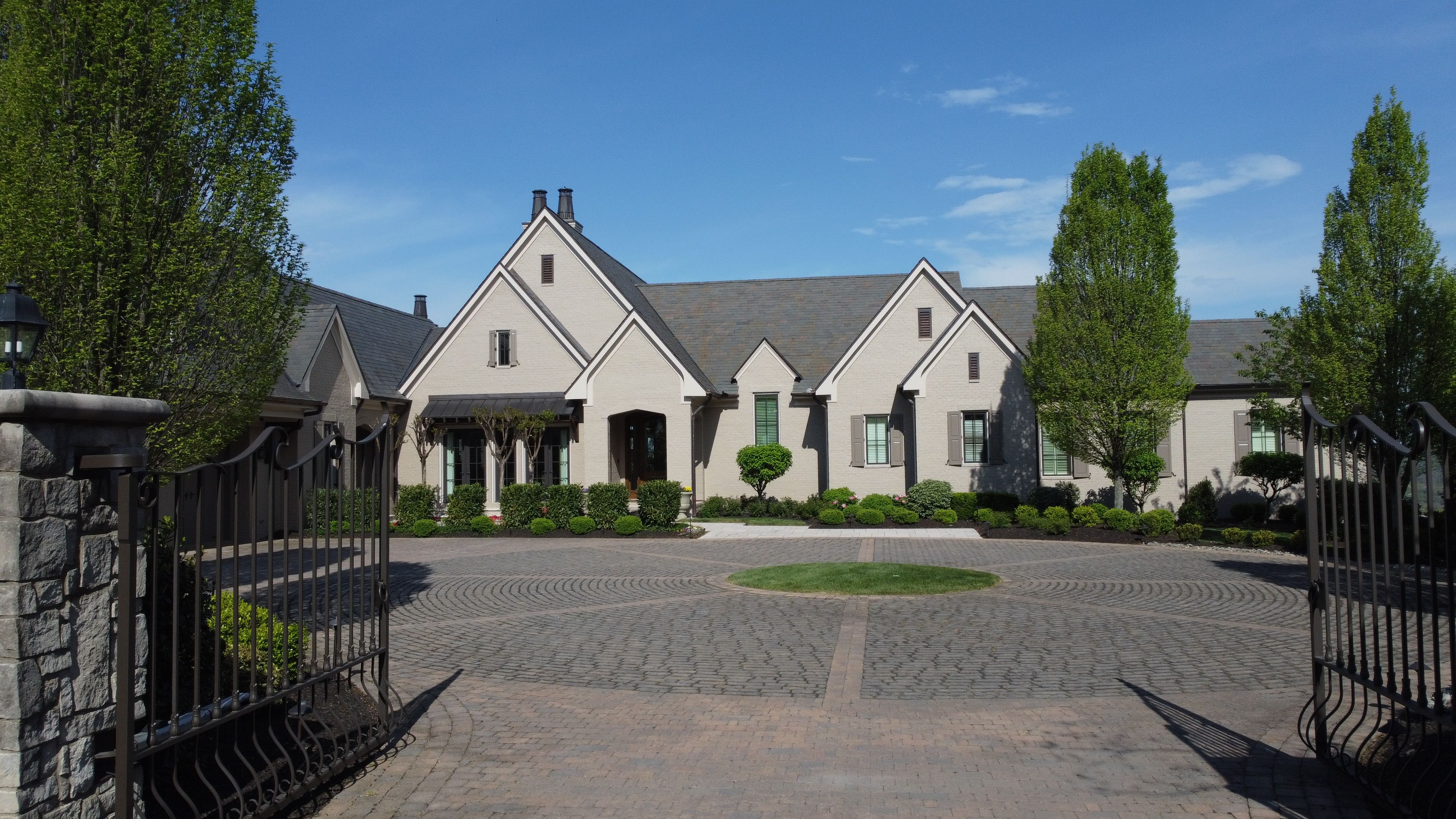Front elevation of a luxury custom european style home built by a custom home builder in Franklin, Tennessee