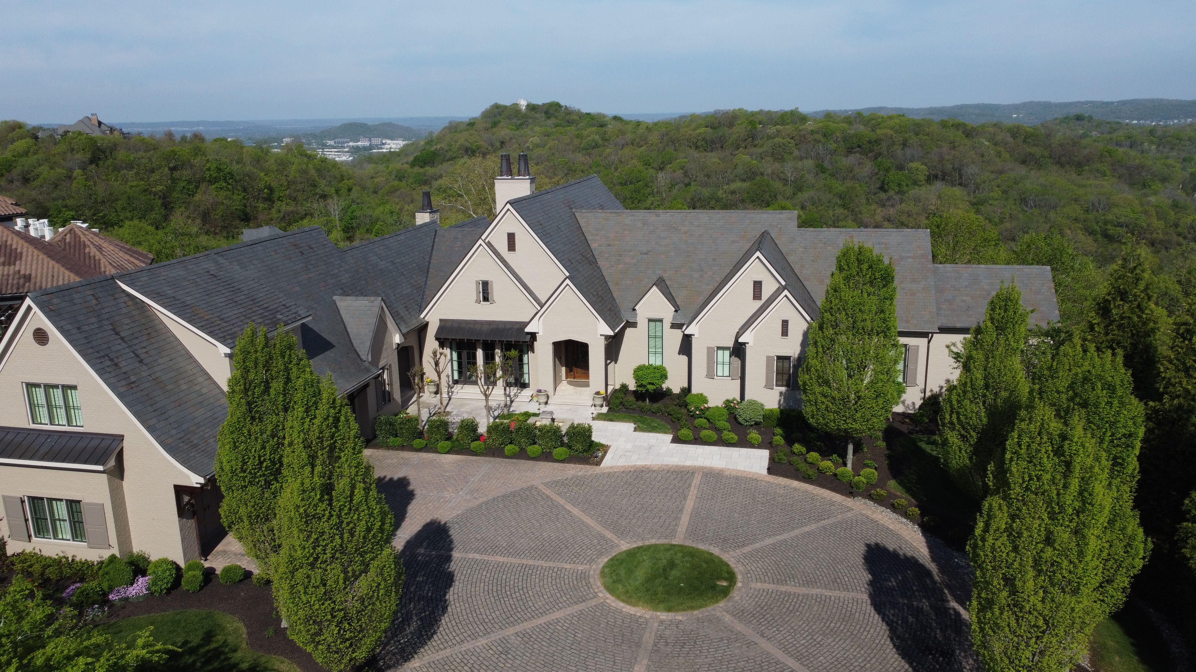 Front elevation view of a luxury custom european style home built by a custom home builder in Franklin, Tennessee