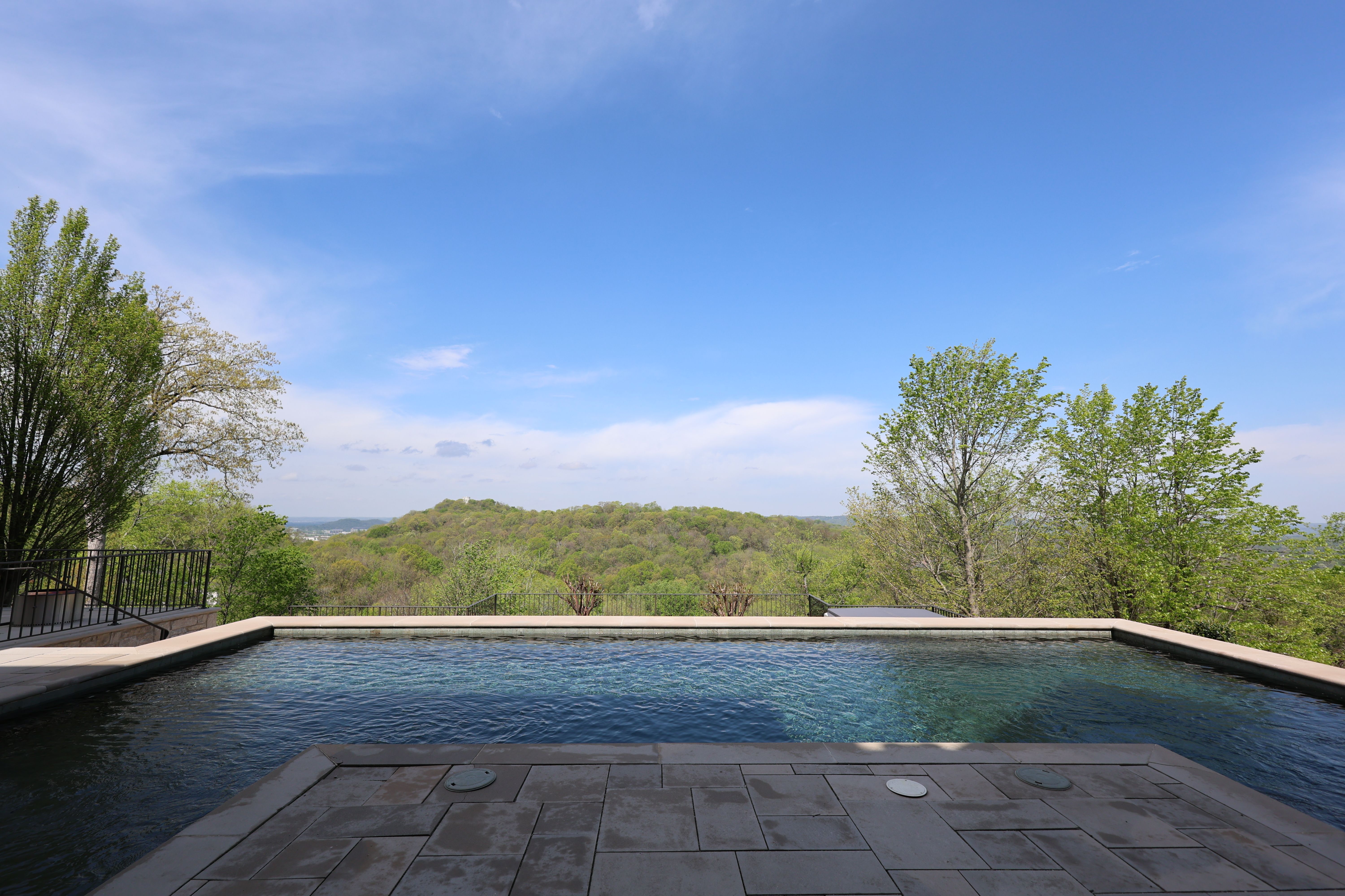 Pool area of a luxury custom european style home built by a custom home builder in Franklin, Tennessee