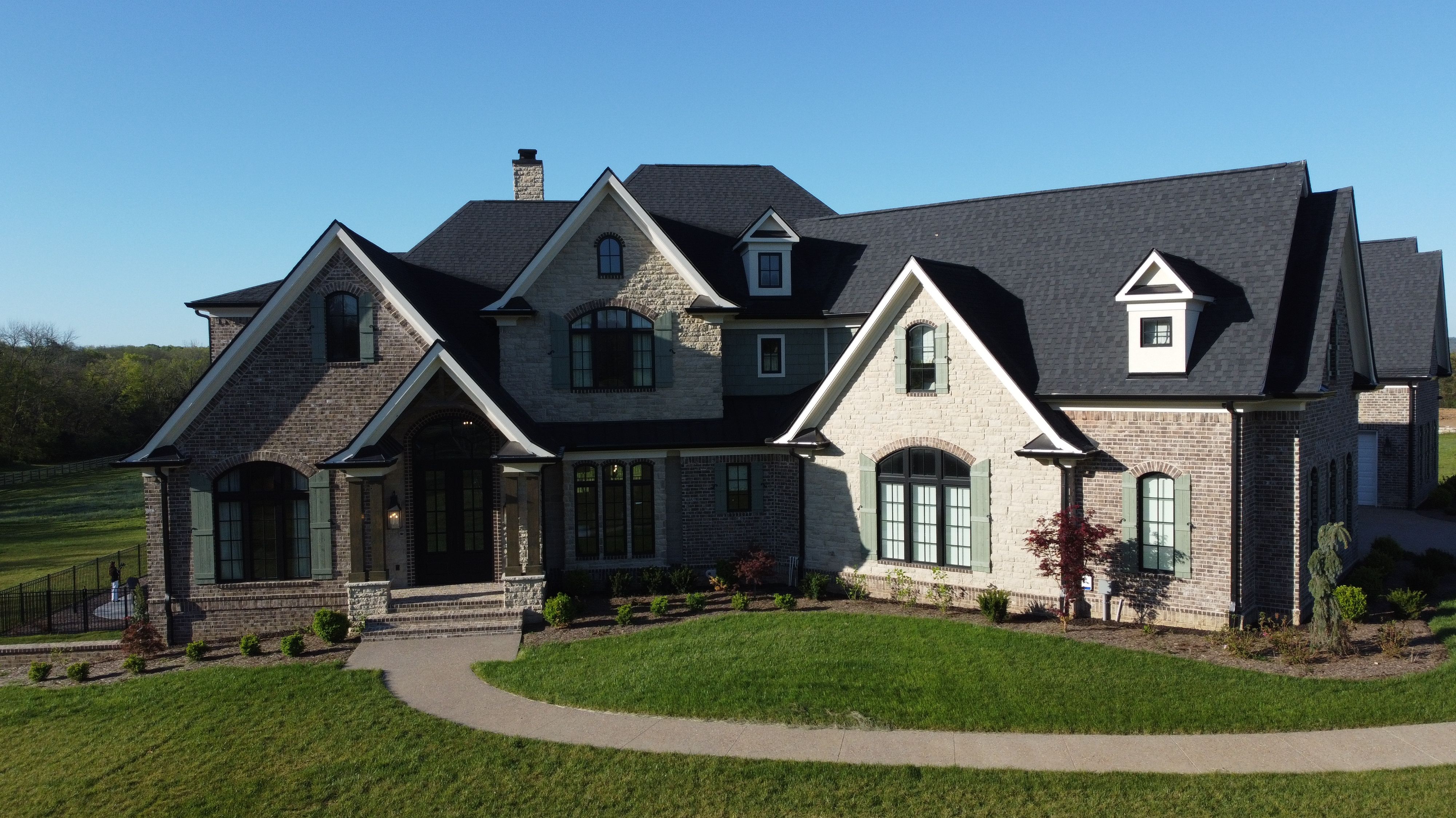 Front elevation of an updated rustic home built by a custom home builder in Nolensville, Tennessee